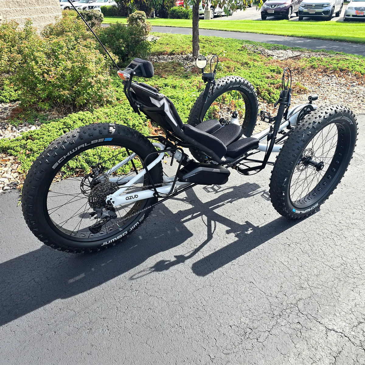 Rear angled side view of the Azub Demo Fat Bosch Performance CX Dynamic Grey Recumbent Trike in an outdoor setting.