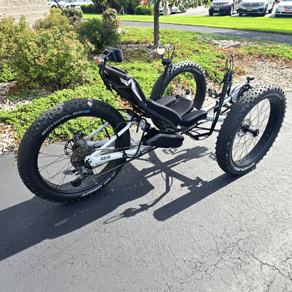 Rear angled side view of the Azub Demo Fat Bosch Performance CX Dynamic Grey Recumbent Trike in an outdoor setting.