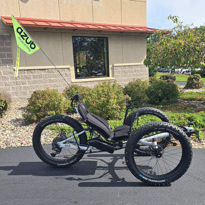 Side view of the Azub Demo Fat Bosch Performance CX Dynamic Grey Recumbent Trike in an outdoor setting.
