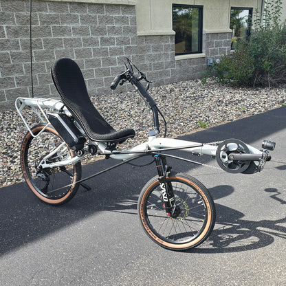 Angled side view of the Azub Demo Six Bosch Performance CX Dynamic Grey Recumbent Bike in an outdoor setting.