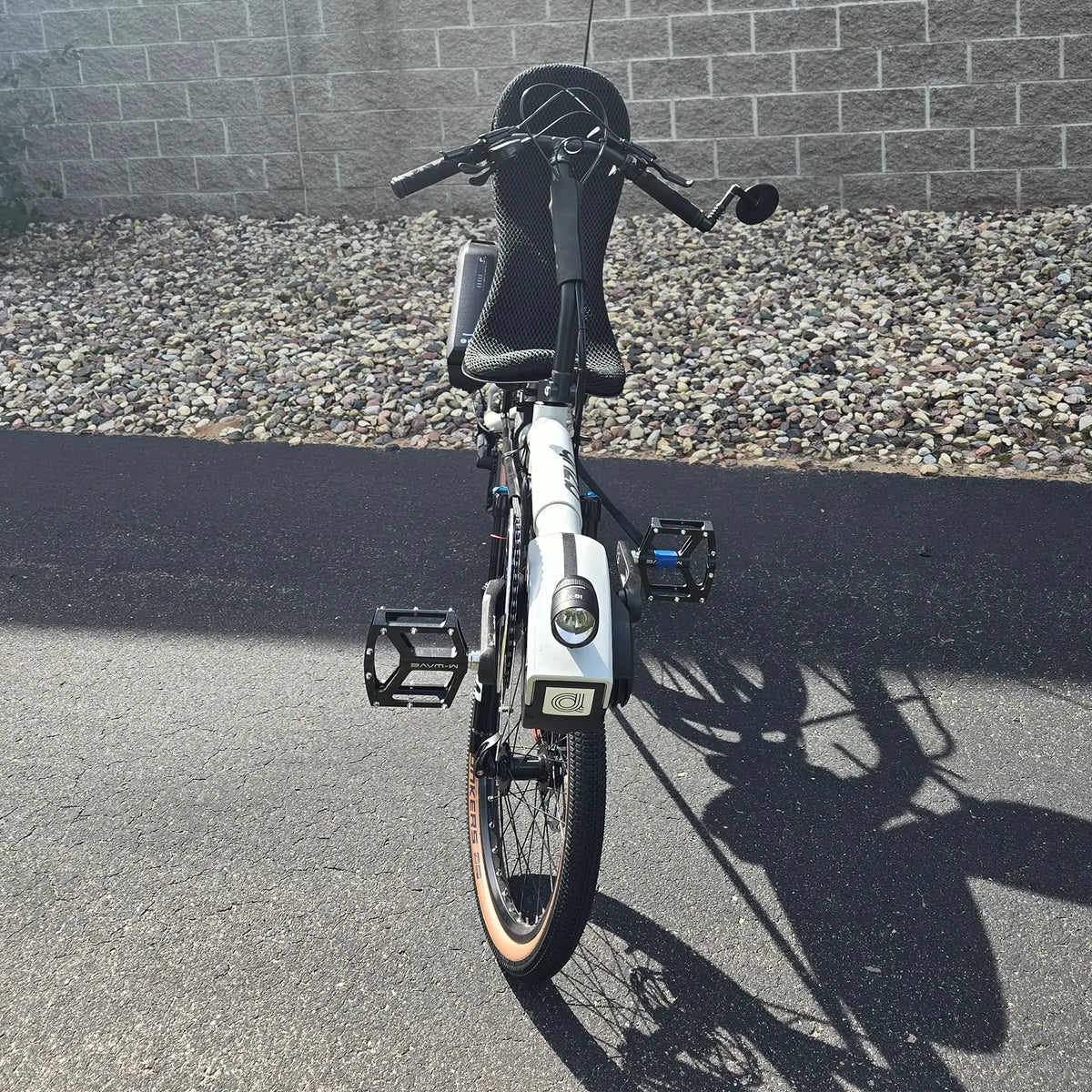 Front view of the Azub Demo Six Bosch Performance CX Dynamic Grey Recumbent Bike in an outdoor setting.