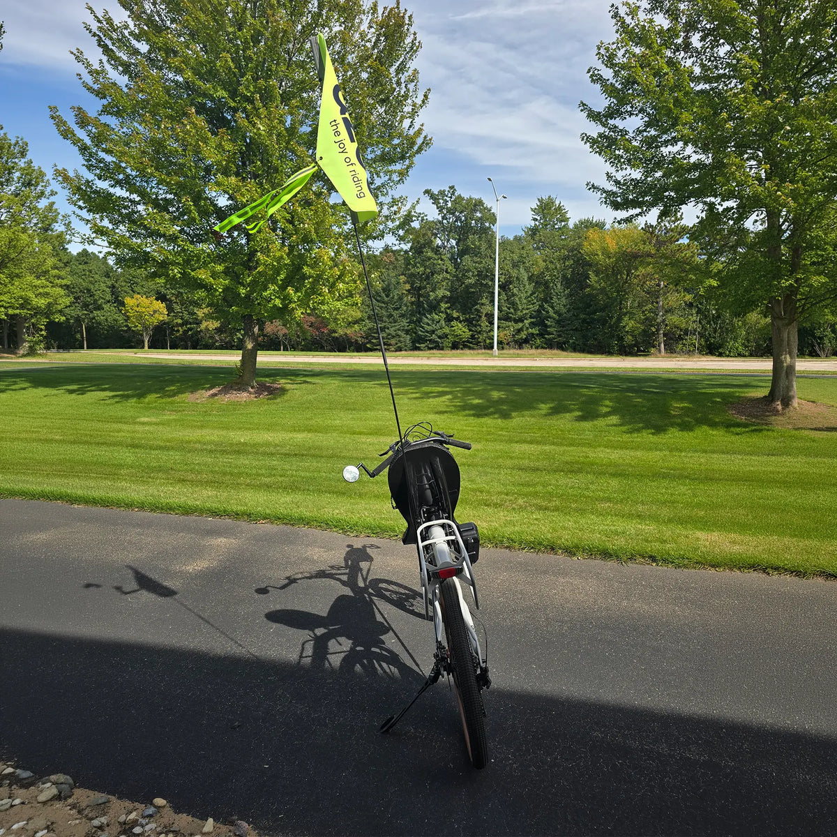Rear view of the Azub Demo Six Bosch Performance CX Dynamic Grey Recumbent Bike in an outdoor setting.