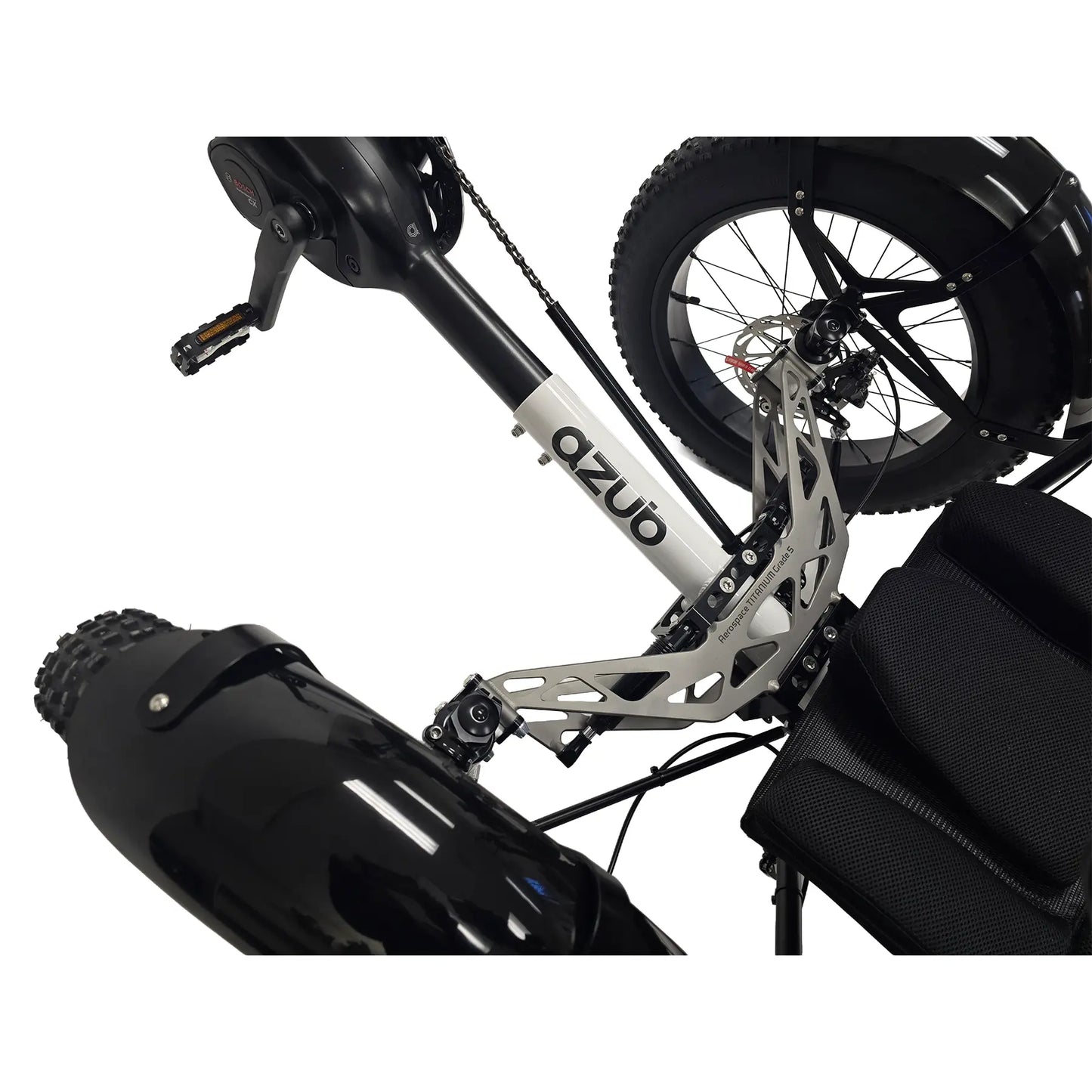 Closeup view of the logo and titanium front suspension on the Azub Limited Edition Ti-Fly X Bosch Performance CX with Rohloff E14 Shiny White Recumbent Trike against a white background.
