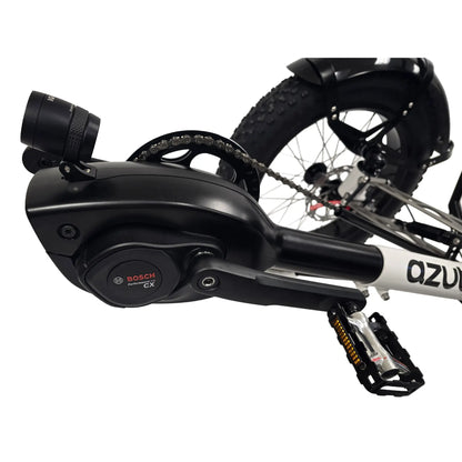 Closeup view of the Bosch performance CX motor on the Azub Limited Edition Ti-Fly X Bosch Performance CX with Rohloff E14 Shiny White Recumbent Trike against a white background.