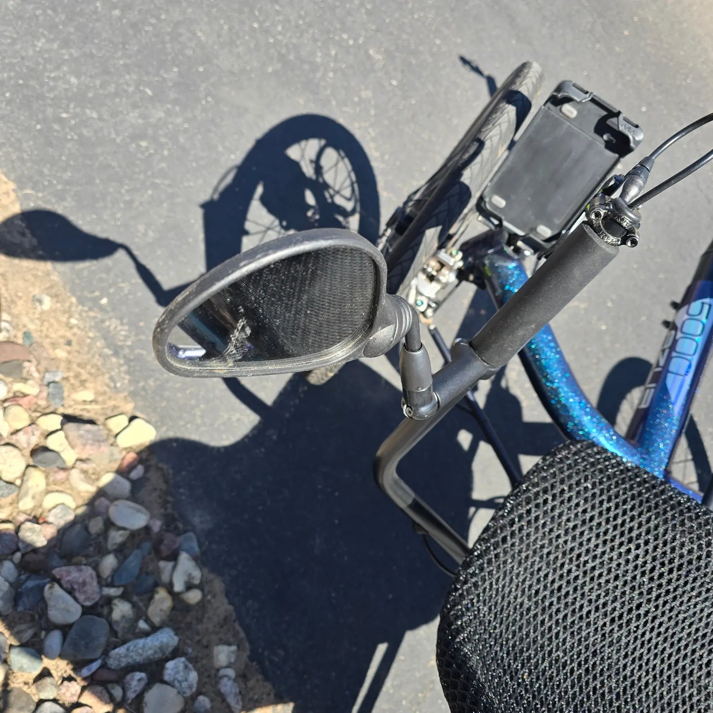 Closeup view of the mirror on the Azub Used T-Tris 5000 Chameleon Teal Custom Recumbent Trike in an outdoor setting.