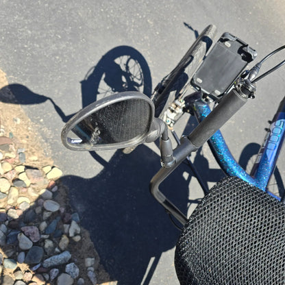 Closeup view of the mirror on the Azub Used T-Tris 5000 Chameleon Teal Custom Recumbent Trike in an outdoor setting.