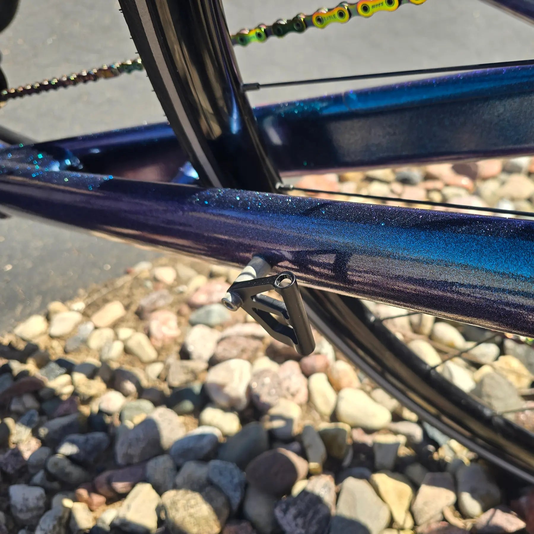 Closeup view of the flag mount on the Azub Used T-Tris 5000 Chameleon Teal Custom Recumbent Trike in an outdoor setting.