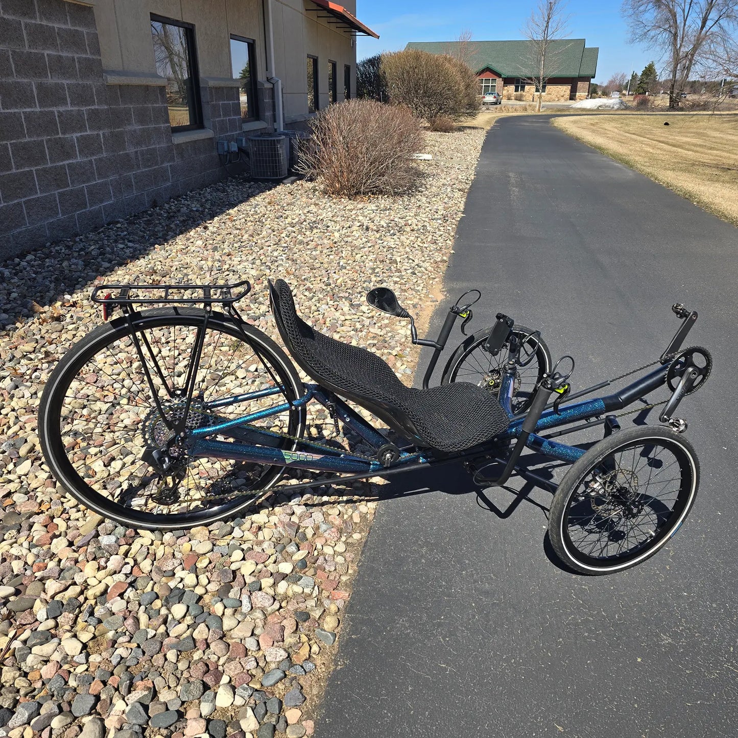 Side view of the Azub Used T-Tris 5000 Chameleon Teal Custom Recumbent Trike in an outdoor setting.