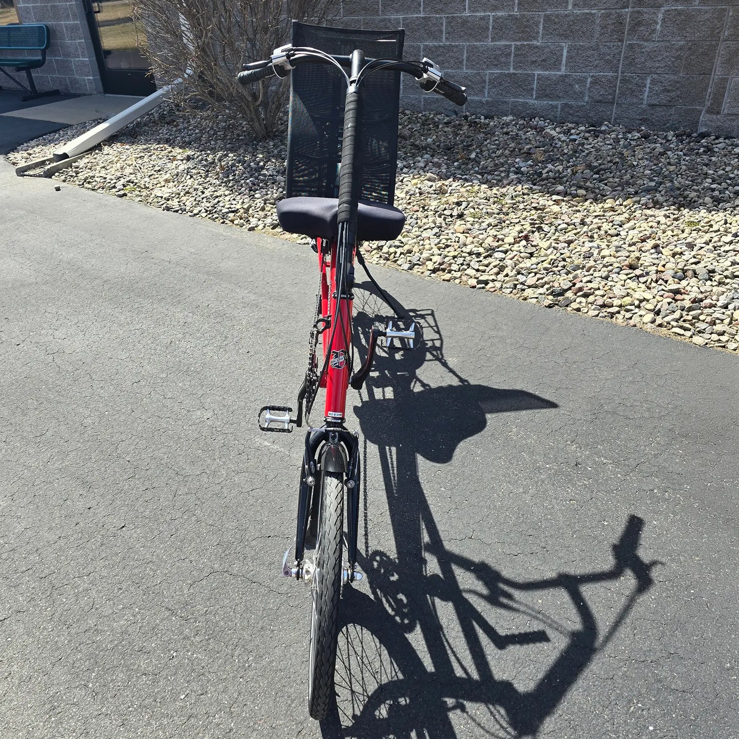 Front view of the Bacchetta Used Bella Red SM-MD Recumbent Bike in an outdoor setting.