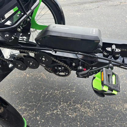 Closeup view of the left stoker crankset and drivetrain on the BamBuk Independent Bosch Performance CX Recumbent Tandem Trike in the Hostel Shoppe parking lot.