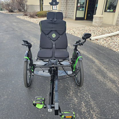 Front view of the BamBuk Independent Bosch Performance CX Recumbent Tandem Trike in the Hostel Shoppe parking lot.