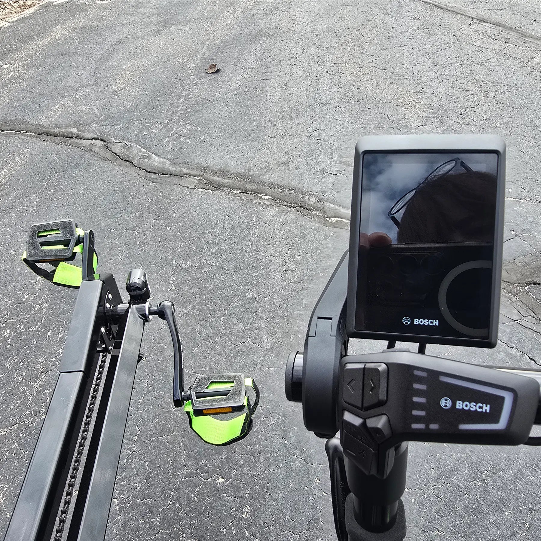 Closeup view of the Bosch controls on the BamBuk Independent Bosch Performance CX Recumbent Tandem Trike in the Hostel Shoppe parking lot.