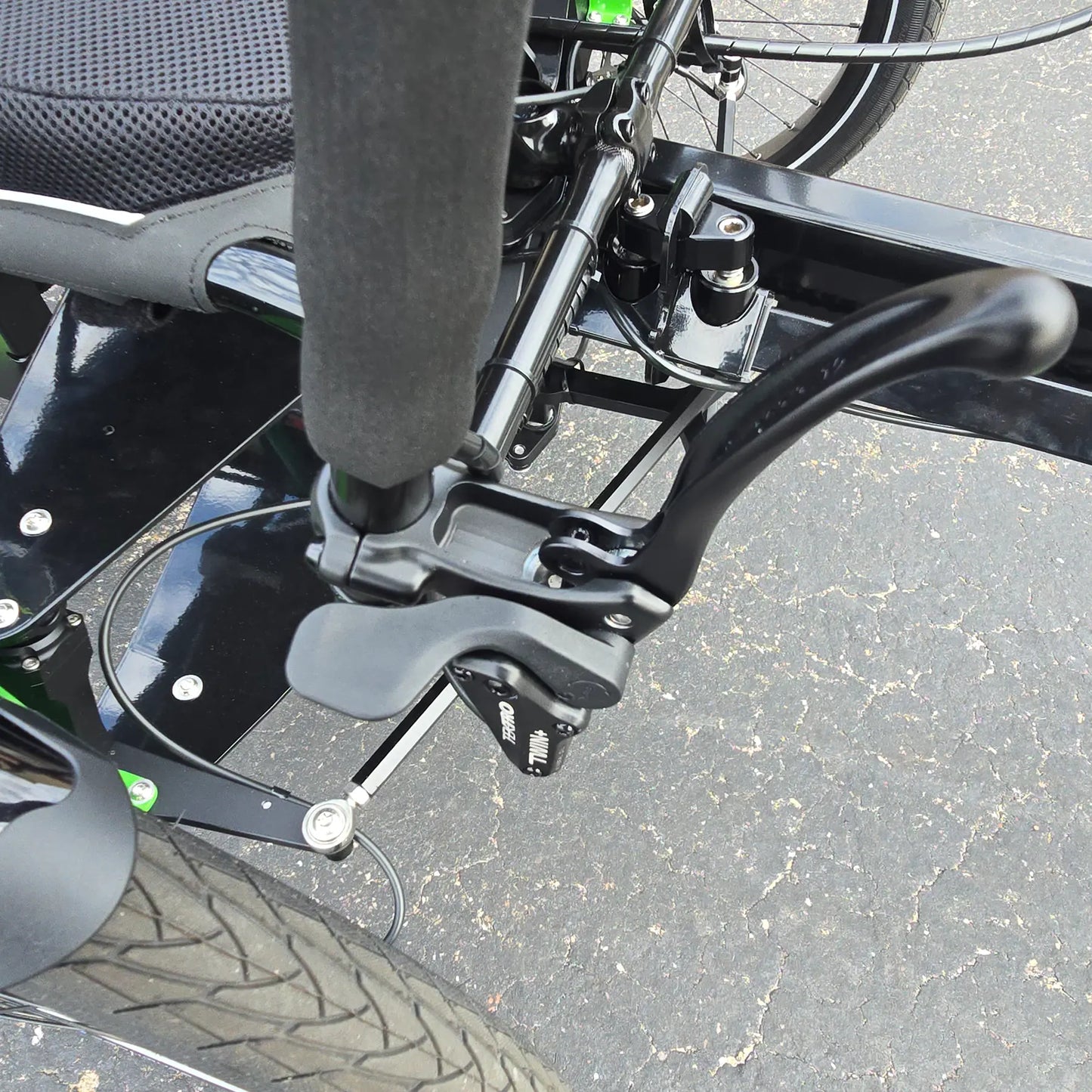 Side view of the locking front brake lever on the BamBuk Independent Bosch Performance CX Recumbent Tandem Trike in the Hostel Shoppe parking lot.