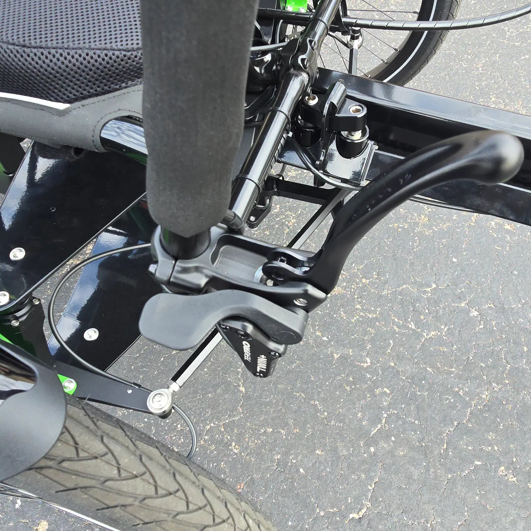 Side view of the locking front brake lever on the BamBuk Independent Bosch Performance CX Recumbent Tandem Trike in the Hostel Shoppe parking lot.