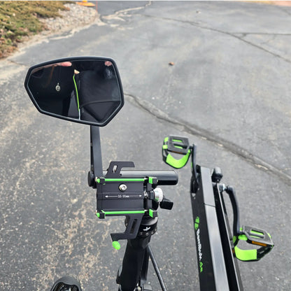 Closeup view of the mirror and the phone mount on the BamBuk Independent Bosch Performance CX Recumbent Tandem Trike in the Hostel Shoppe parking lot.
