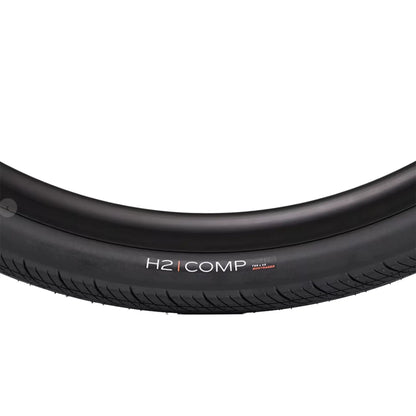 Closeup side profile of the Bontrager H2 Comp Hybrid Tire 26 x 2.0 inch (50-559mm) against a white background.