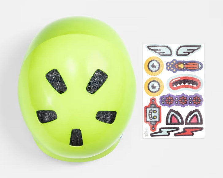 Top down view of a yellowish green Bontrager Jet Wavecel helmet next to a sheet of colorful stickers on a white background.