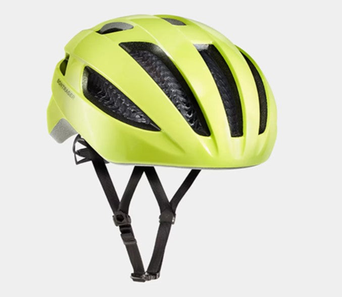 Bright yellow Bontrager Starvos helmet with black straps on a light gray background.