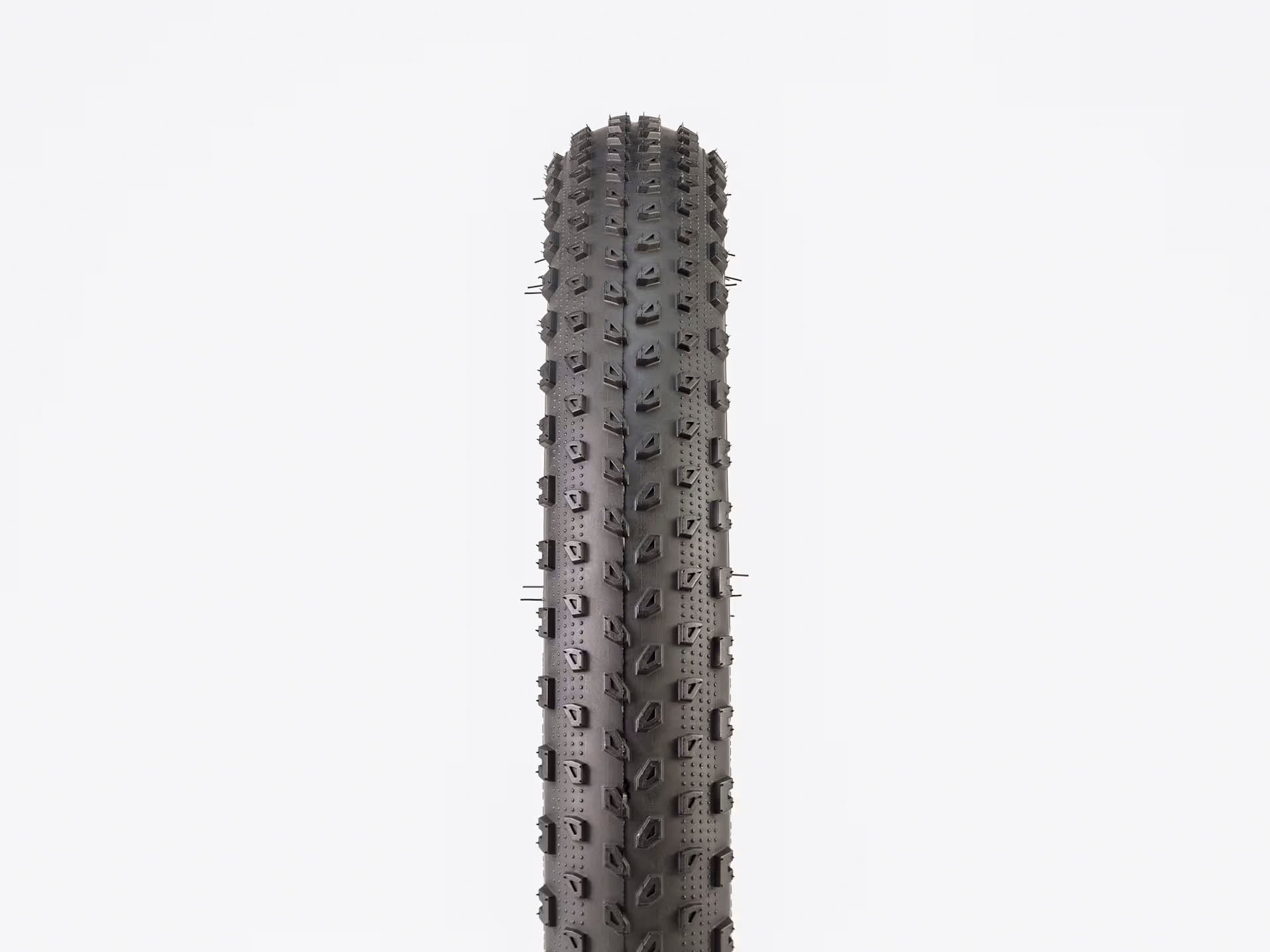 Front view of the Bontrager XR1 Tire, detailing the tread pattern and shown with a white background.
