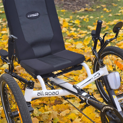 Front closeup view of the Catrike All Road in Star White in an outdoor fall setting.