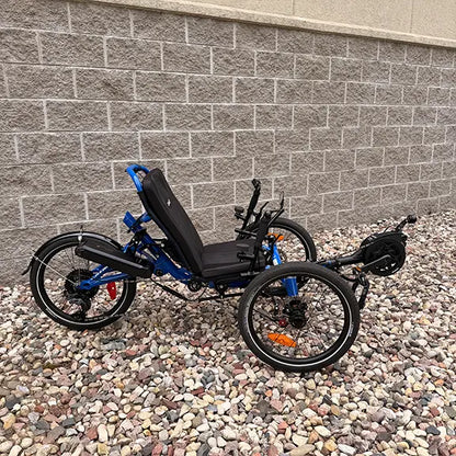 Side view of the Catrike Demo All Road eCat with Bosch BES3 Electric Blue Recumbent Trike in an outdoor setting.
