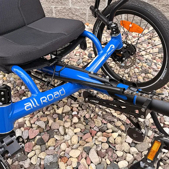 Closeup front view of the Catrike Demo All Road eCat with Bosch BES3 Electric Blue Recumbent Trike in an outdoor setting.