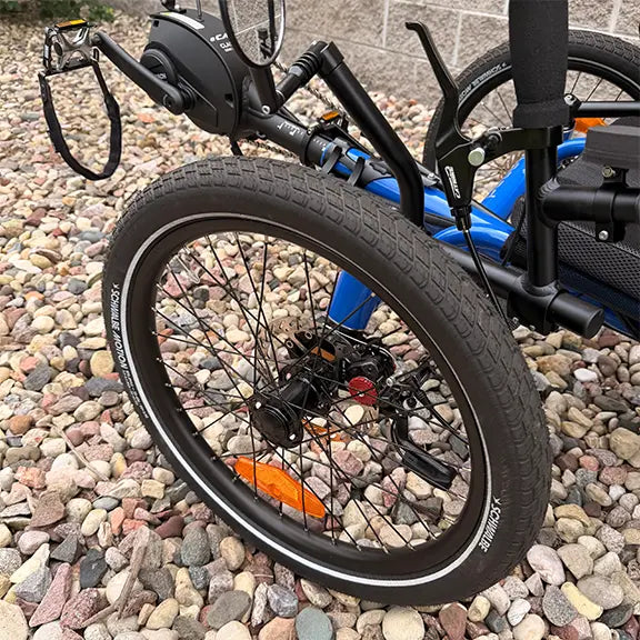 Close up front side view of the Catrike Demo All Road eCat with Bosch BES3 Electric Blue Recumbent Trike in an outdoor setting.