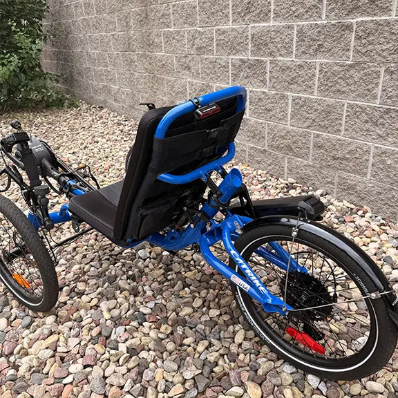 Angled back view of the Catrike Demo All Road eCat with Bosch BES3 Electric Blue Recumbent Trike in an outdoor setting.