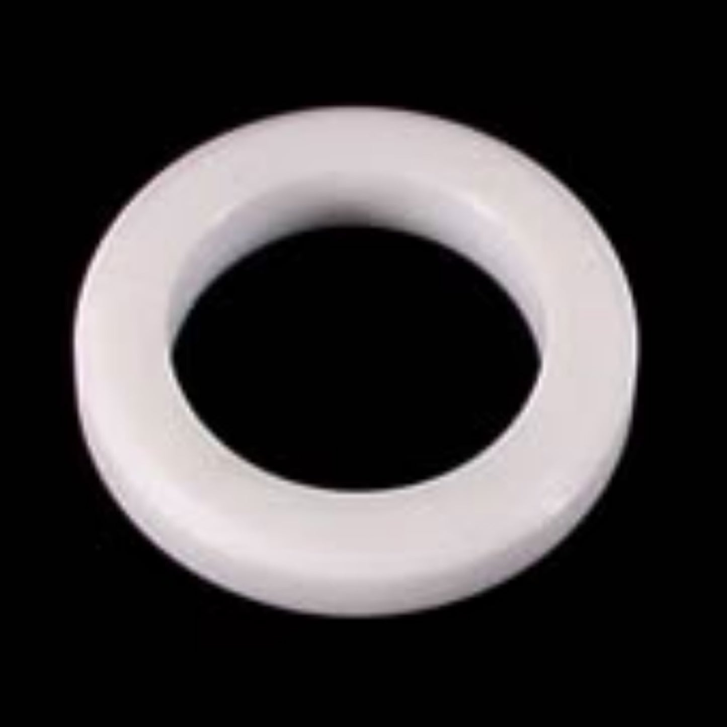 White teflon bearing for Catrike recumbent trikes against a black background.