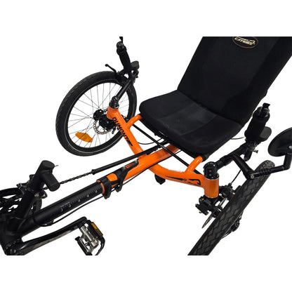 Closeup front view of the Catrike Used Dumont Atomic Orange Recumbent Trike against a white background.
