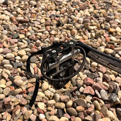 Closeup view of the pedal with toe clip, strap and bungee heel support on the Catrike Used Pocket Eon Green Recumbent Trike in an outdoor setting.