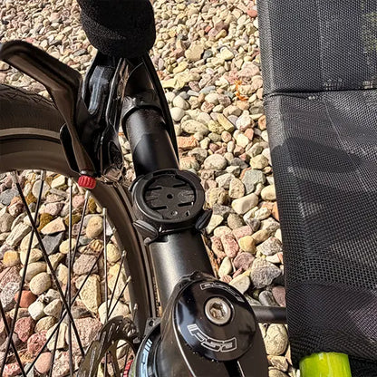 Closeup view of the brake lever and Garmin Mount on the Catrike Used Pocket Eon Green Recumbent Trike in an outdoor setting.