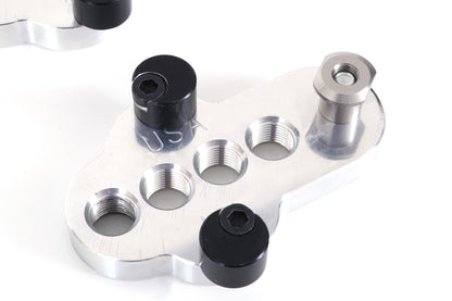 Closeup of a silver CJ Ackley Machine Company Wide Crank Arm Shortener.