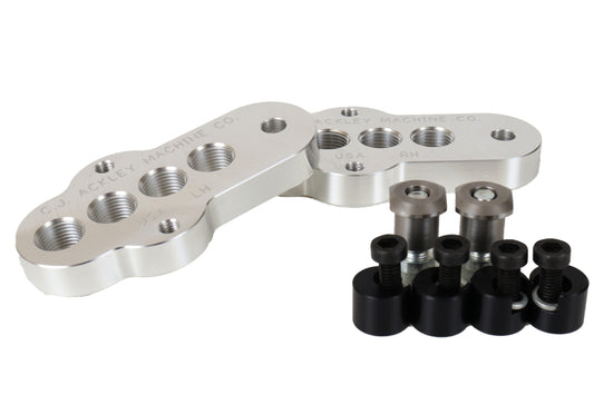 A pair of CJ Ackley Machine Company Narrow Crank Arm Shorteners in silver with attachment parts.