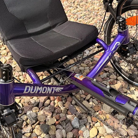 Closeup view of the frame on the Catrike Demo Dumont Compact Candy Purple Recumbent Trike in an outdoor setting.