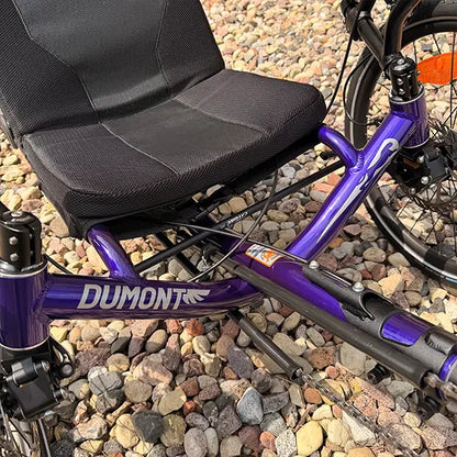 Closeup view of the frame on the Catrike Demo Dumont Compact Candy Purple Recumbent Trike in an outdoor setting.
