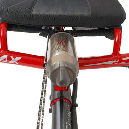 Front view of the Fidlock TWIST 750 Compact Single Bottle in Smoke mounted on a red recumbent trike against a white background.
