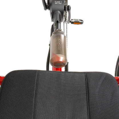Back view of the Fidlock TWIST 750 Compact Single Bottle in Smoke mounted on a red recumbent trike against a white background.