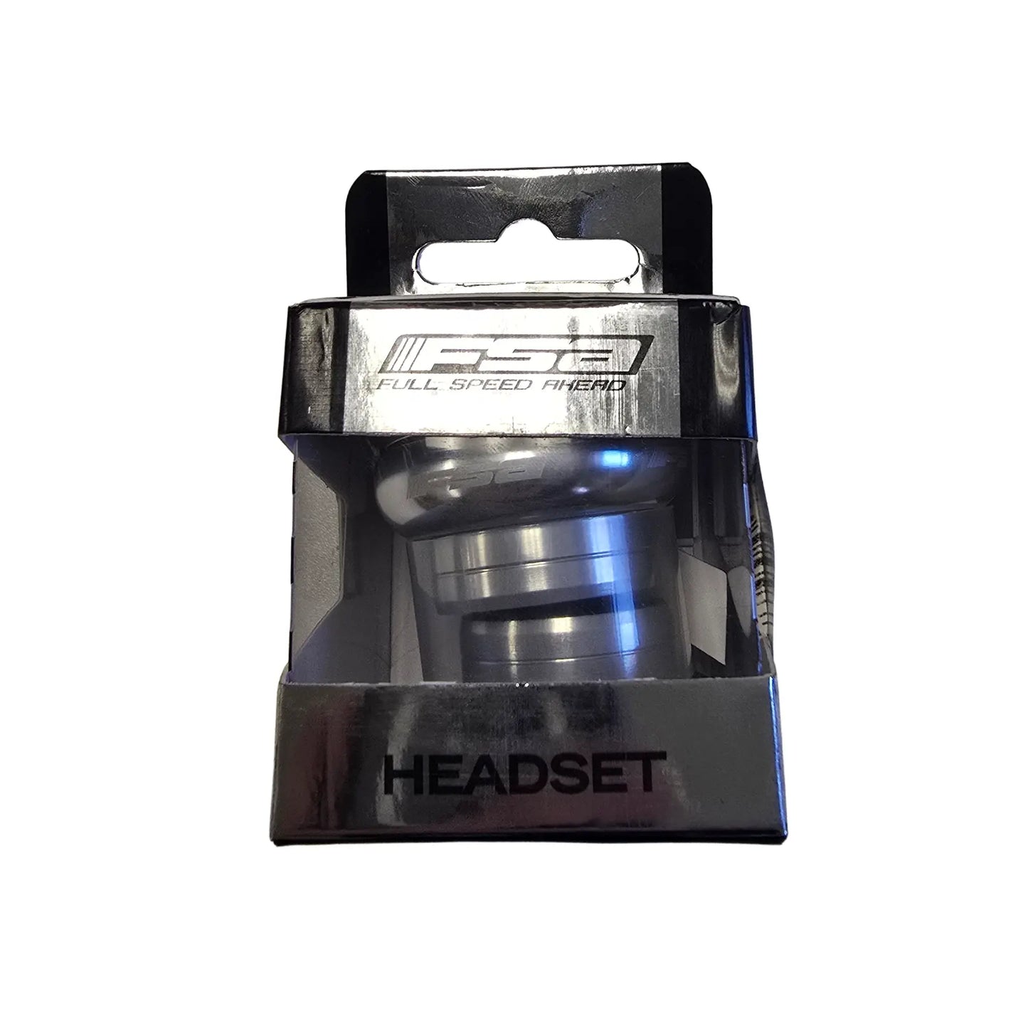 Side profile of the black and silver box for the Full Speed Ahead Orbit X 1 inch Threadless Headset in silver against a white background.