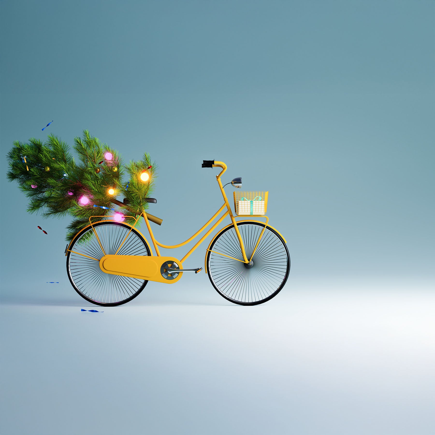 A yellow bike carrying a Christmas tree and a gift are against a blue background.