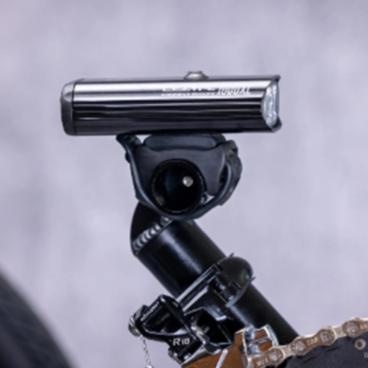 Closeup view of the Greenspeed Magnum XL Recumbent Trike light mount against a grey background.