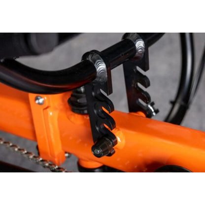Closeup view of the Greenspeed Magnum XL Recumbent Trike in Tangerine Dream seat hieght adjustment against a grey background.