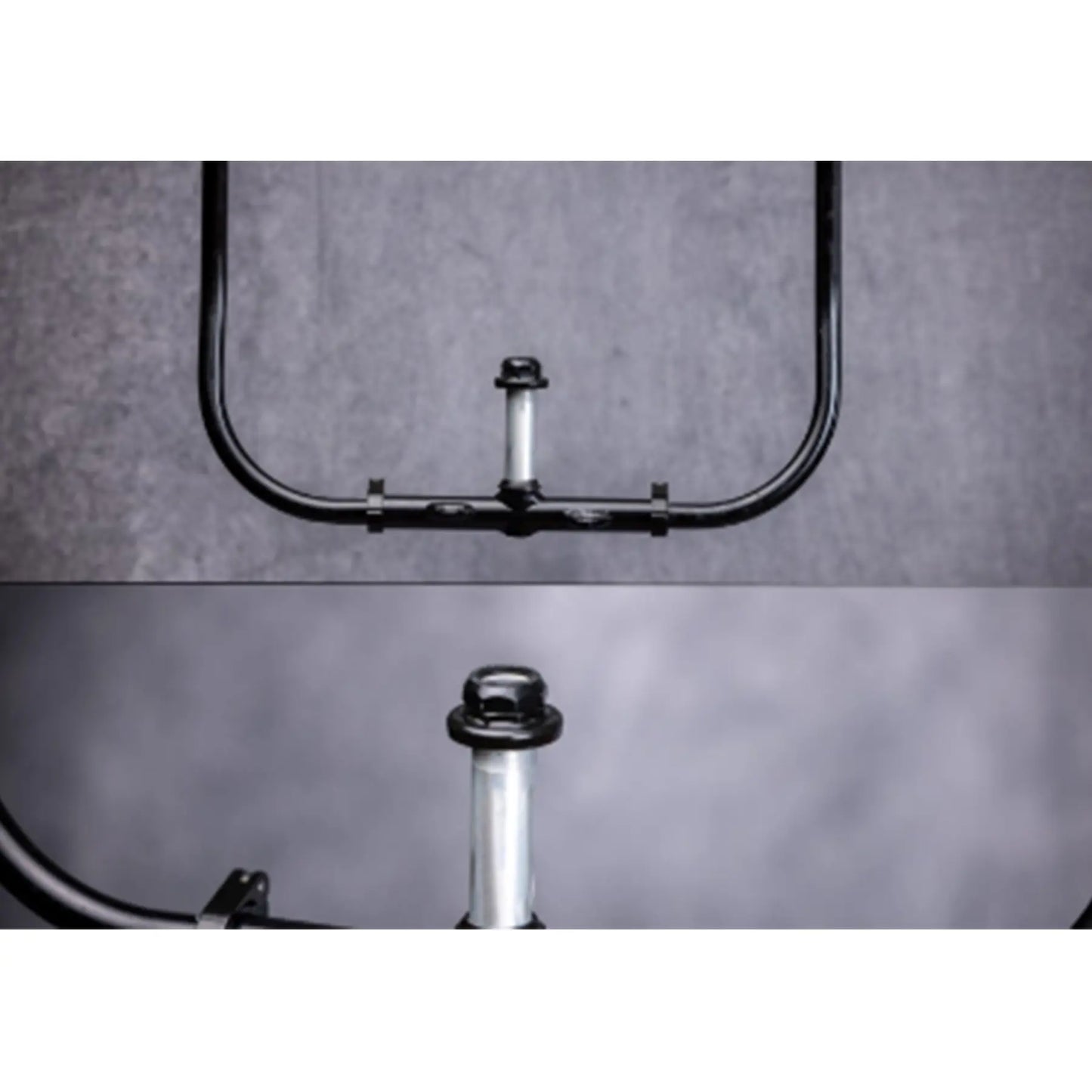 Closeup view of the Greenspeed Magnum XL Recumbent Trike handlebars against a grey background.