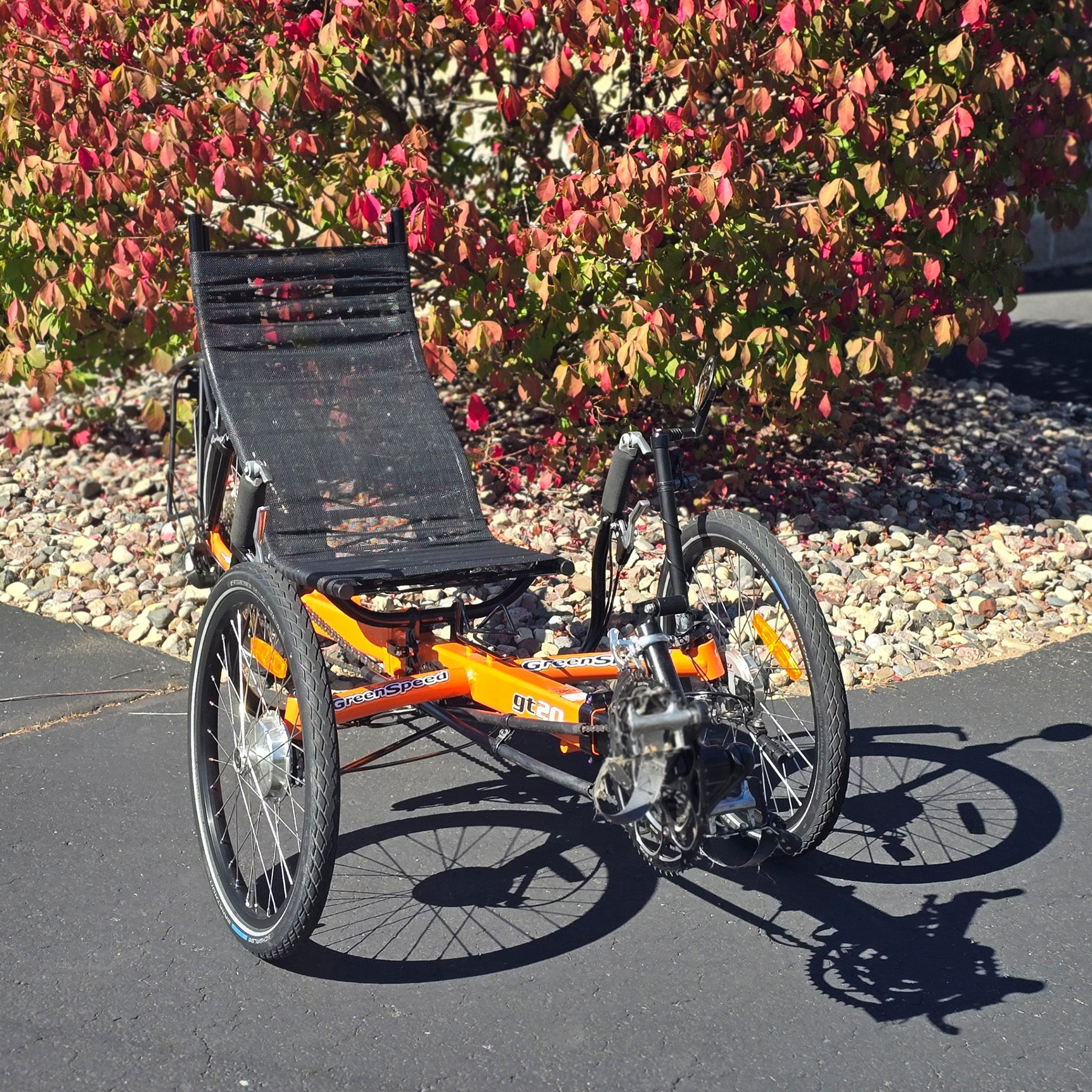 Front angled view of a used Greenspeed GT20 in orange in an outdoor setting.