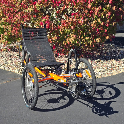 Front angled view of a used Greenspeed GT20 in orange in an outdoor setting.
