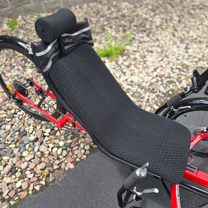 Closeup view of the seat pad, neckrest and seat bag on the Greenspeed Used GT26 with E.B.O. e-Assist Red Recumbent Trike in an outdoor setting.