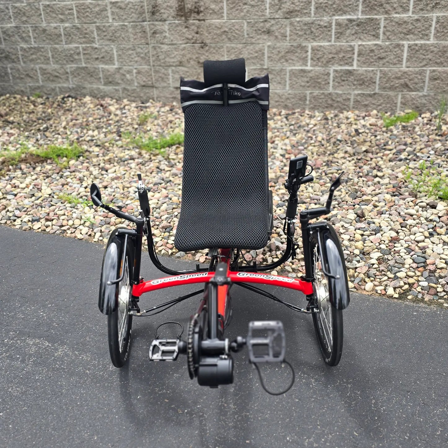 Front view of the Greenspeed Used GT26 with E.B.O. e-Assist Red Recumbent Trike in an outdoor setting.