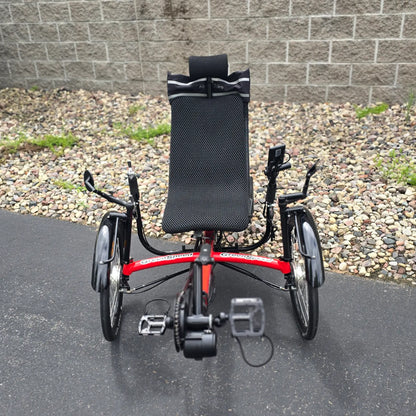 Front view of the Greenspeed Used GT26 with E.B.O. e-Assist Red Recumbent Trike in an outdoor setting.