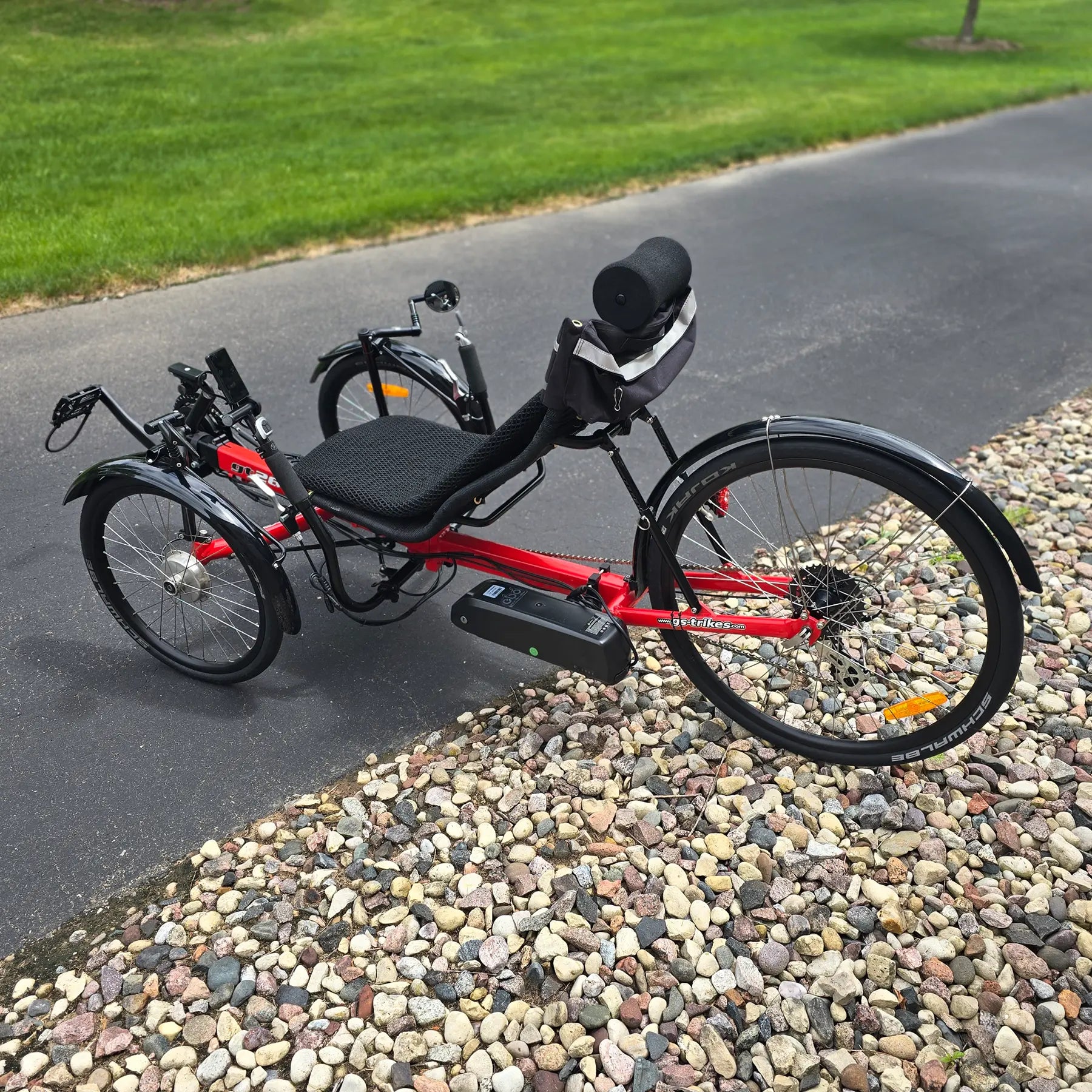 Non-drive side view of the Greenspeed Used GT26 with E.B.O. e-Assist Red Recumbent Trike in an outdoor setting.