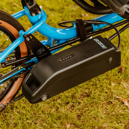 Closeup view of the battery on the GRIDE Solutions GXT Plus E-Trike Drive System for 20 inch Rear Wheels mounted on a blue ICE trike in an outdoor setting.